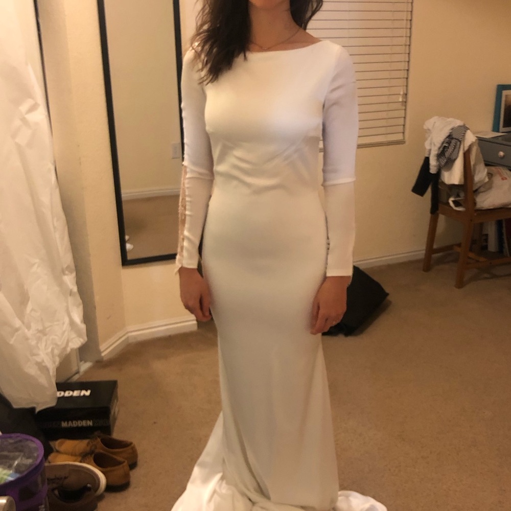 Long sleeve wedding dress w/ lace back.